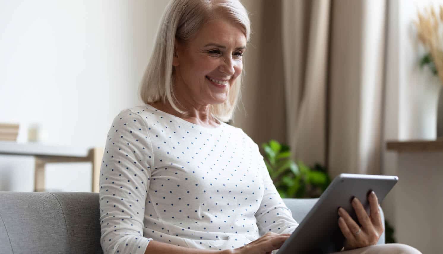 Woman with tablet getting estate plan done at home