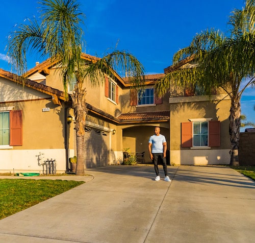 Man in front of Southern California Home